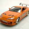 JADA Modellauto Toyota Supra 1995 orange Fast & Furious mit Brian Figur Modellauto